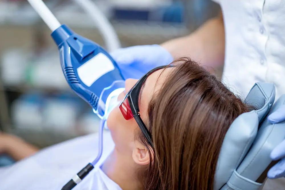 BDGWHITE copy woman undergoing teeth whitening
